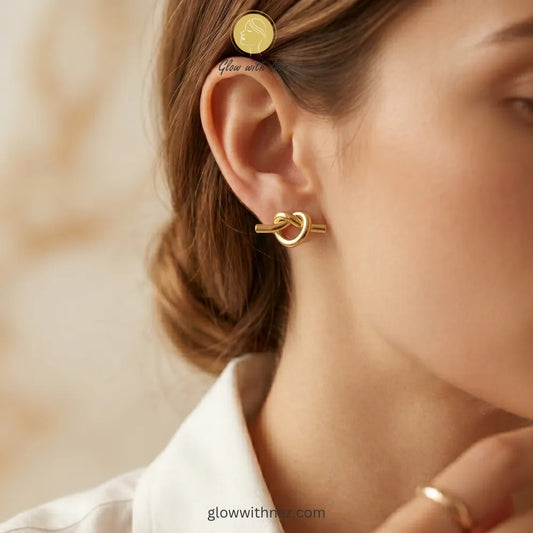 Front view of elegant gold knot studs for casual or formal wear