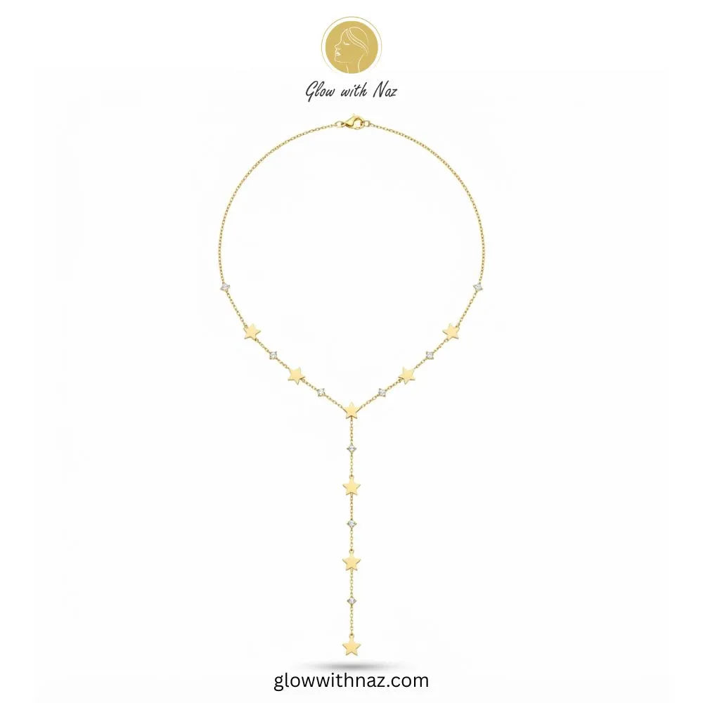 Gold plated Y-shaped lariat necklace with seven star charms and cubic zircon accents by Glow With Naz