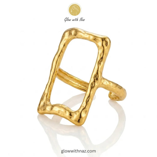 An elegant gold stainless steel ring featuring an open rectangle frame with a unique hammered texture.