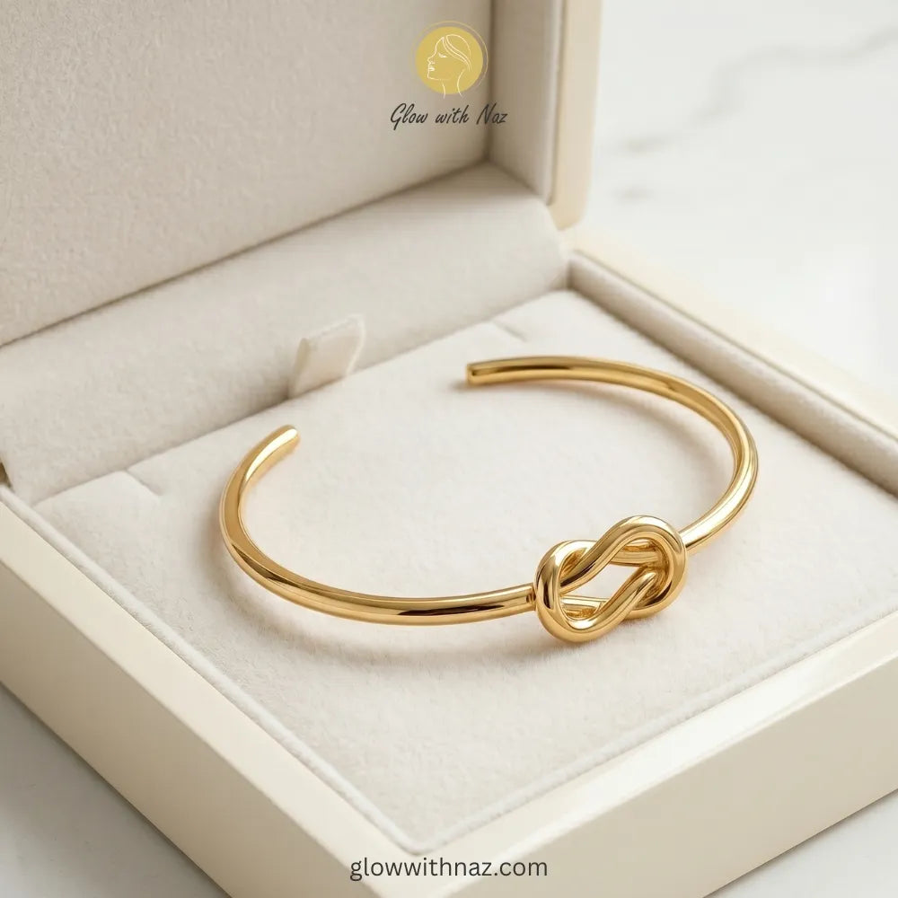 Minimalist gold knot cuff styled for everyday luxury