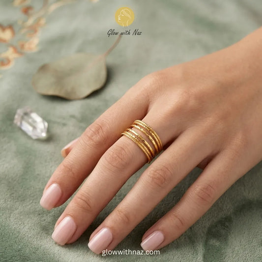 A gold stainless steel ring featuring a multi-layer stacked design, fully adjustable for a perfect fit.