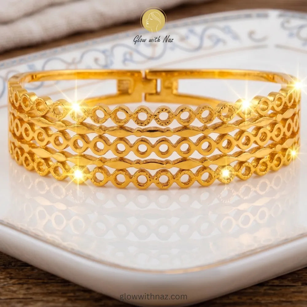 Multi-layered gold bangle stacked with luxury wrist accessories