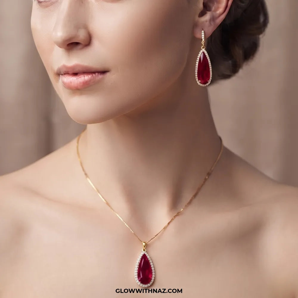 Ruby teardrop pendant necklace and earrings, close-up