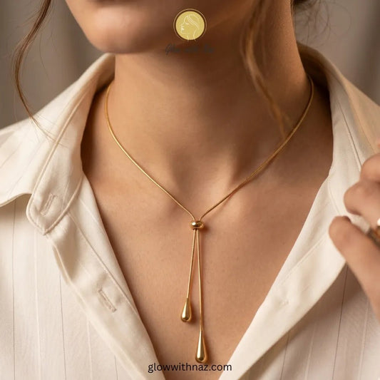 Adjustable Gold Drop Lariat Stainless Steel Pendant Necklace - Adjustable Gold Drop Lariat Stainless Steel Pendant NecklaceJewelryGlow With NazGlow With NazN0044N0044Close-up of sliding mechanism and teardrop pendants necklace, pendant necklace, necklace set, locket set, simple necklace, pendant set, pendant, chain necklace, diamond pendant, diamond necklace, locket necklace, neck chain, girls locket, heart locket, pendant for girls, necklace for girls, heart necklace, locket for girls, diamond