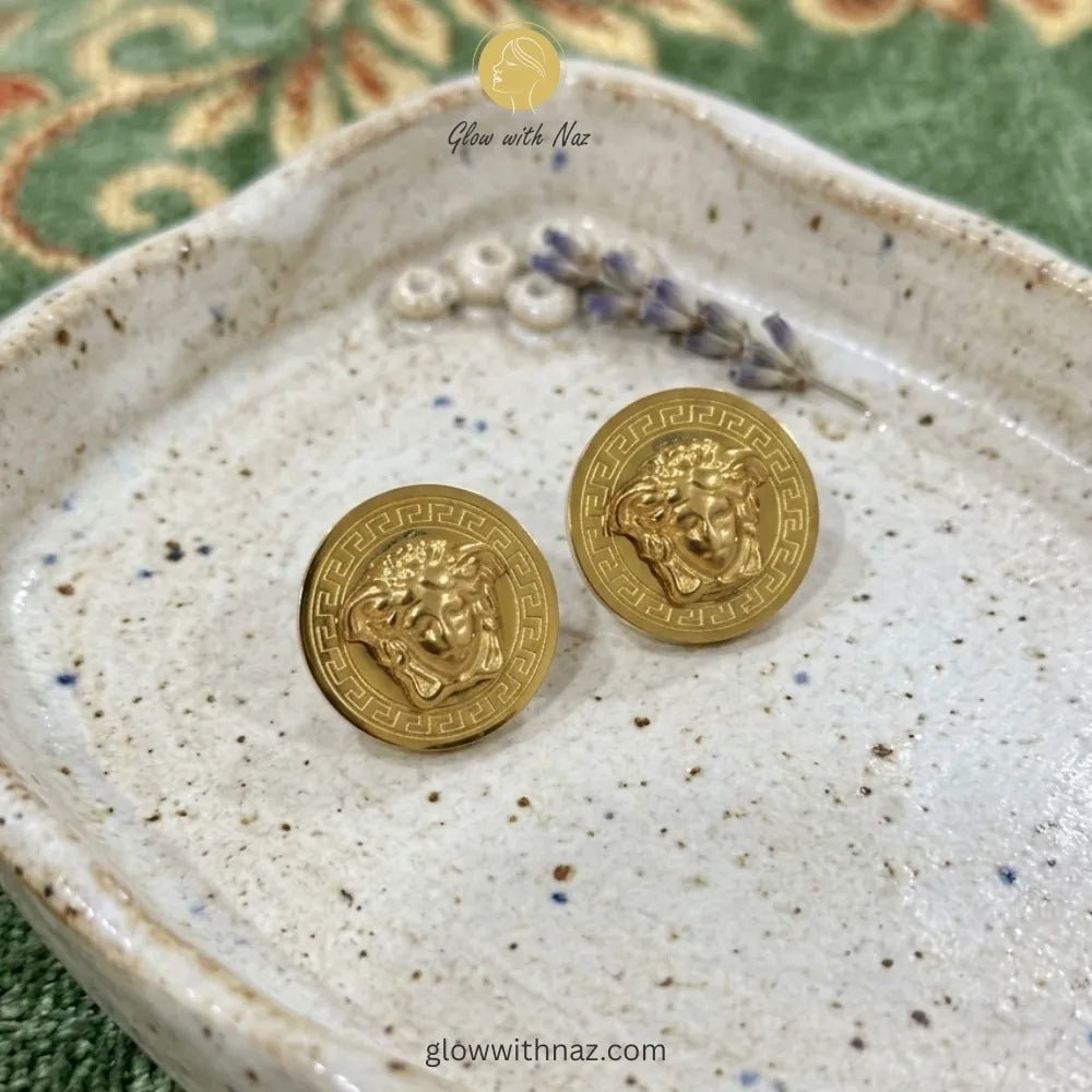 Anti Tarnish Gold Stud Versace Medusa Earring Studs - Anti Tarnish Gold Stud Versace Medusa Earring StudsJewelryGlow With NazGlow With NazE020E020Close-up detail of the intricate portrait and polished gold finish