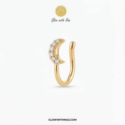 Gold non-pierced chutki crescent moon nose pin with clear zircon crystals on white background by Glow With Naz