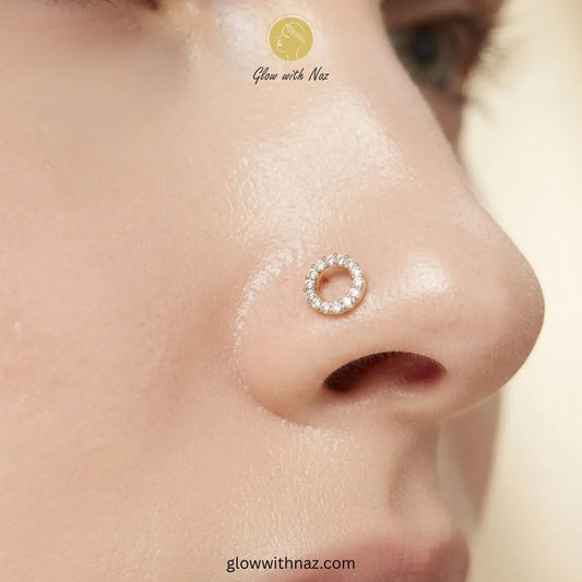 Gold hollow circle CZ stud worn as a nose pin piercing by Glow With Naz