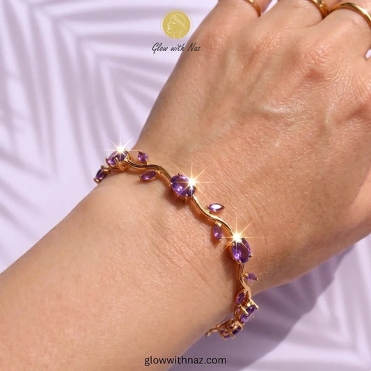 Premium Purple Tulip Bracelet | Rapunzel Floral Stainless Steel Bracelet - Premium Purple Tulip Bracelet | Rapunzel Floral Stainless Steel BraceletJewelryGlow With NazGlow With NazTB002AGold bracelet with purple stones on a wrist against a white background Tulip Rapunzel bracelet, floral tulip bracelet, Rapunzel inspired jewelry, aesthetic tulip bracelet, trendy charm bracelet, stainless steel tulip bracelet, gold plated flower bracelet, delicate floral wrist accessory, cute aesthetic jewelry, v