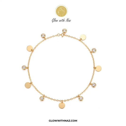 Stainless Steel Diamond Coin Anklet - Stainless Steel Diamond Coin AnkletJewelryGlow With NazGlow With NazA006A gold chain anklet with multiple round gold disc charms and several bezel-set clear stones, displayed on a clean white background with the brand logo 'Glow with Naz' above and 'GLOWWITHNAZ.COM' below.