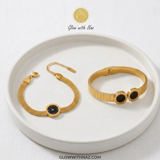 Gold stainless steel Roman numeral cuff bracelet with black onyx and watch-style mesh band on a woman’s wrist – Glow With Naz