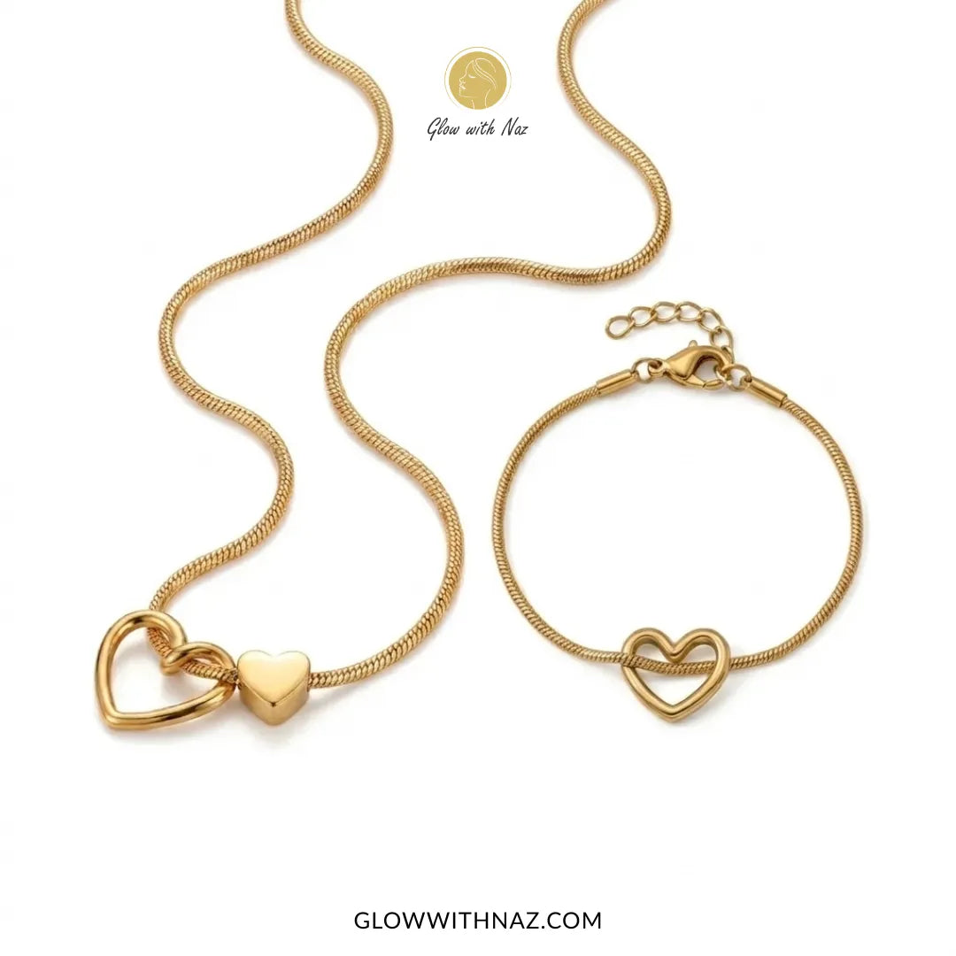 Gold double heart necklace and heart charm bracelet worn together