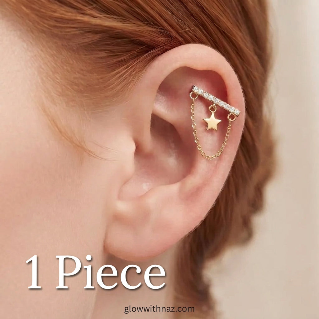 316L Stainless Steel Diamond Bar Helix Jewelry - Trending Star Cartilage Earring - #316L Stainless Steel Diamond Bar Helix Jewelry - Trending Star Cartilage EarringJewelryGlow With NazGlow With NazE074A close-up of a person's ear wearing a gold ear cuff with a barbell, small clear stones, and a dangling star charm.#