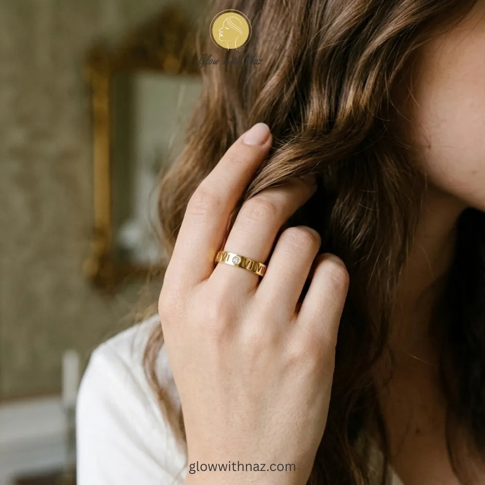 Close-up of a modern abstract gold teardrop ring featuring a sculptural silhouette.