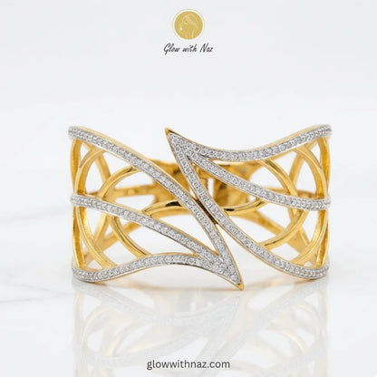 Angled view showing the width and craftsmanship of the gold cuff