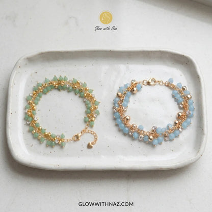 Sea green and sky blue crystal bead cluster bracelet in gold on wrist, trendy beaded bracelet for women by Glow With Naz