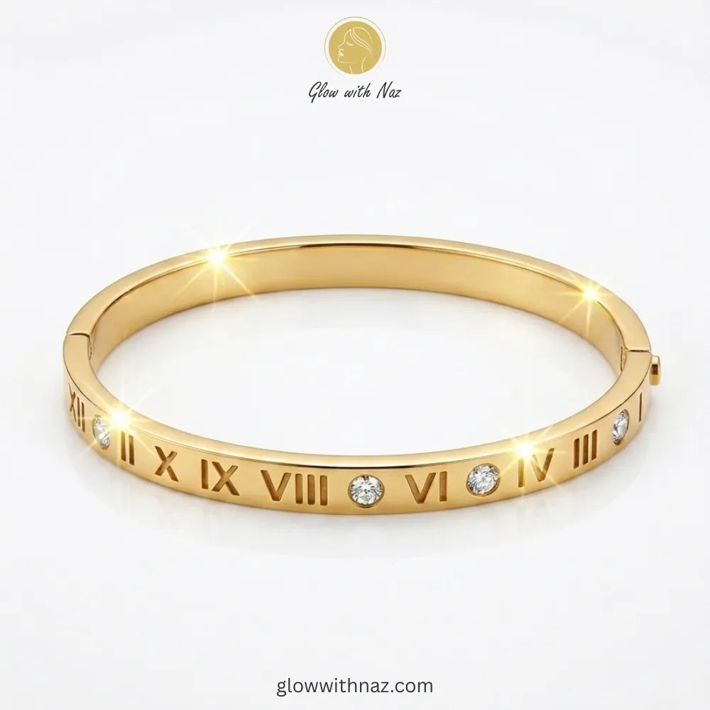 Elegant Roman numeral gold bangle with sparkling stone accents by Glow with Naz