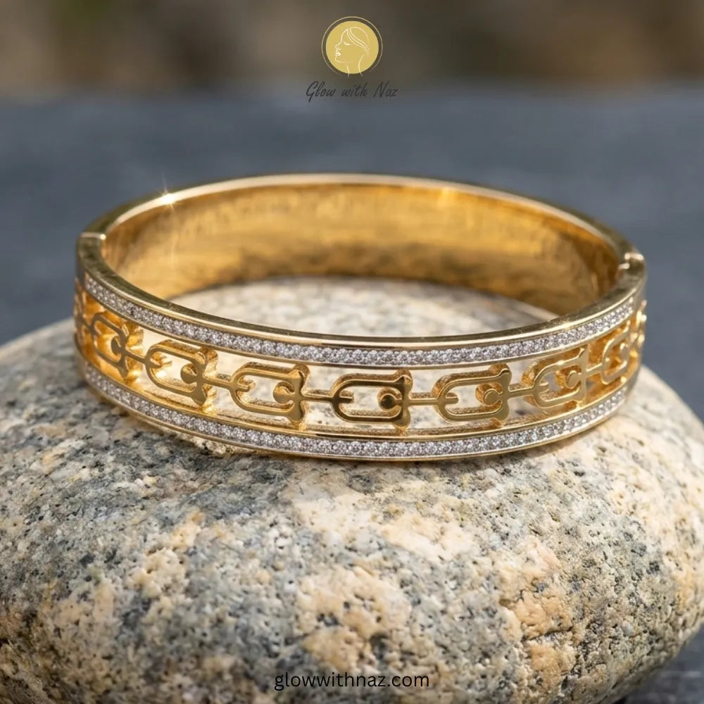 Elegant cut-out gold bangle stacked with luxury wrist accessories