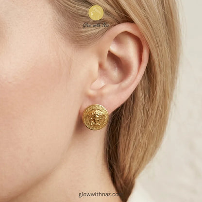 Front view of bold gold portrait stud earrings for formal or high-fashion looks