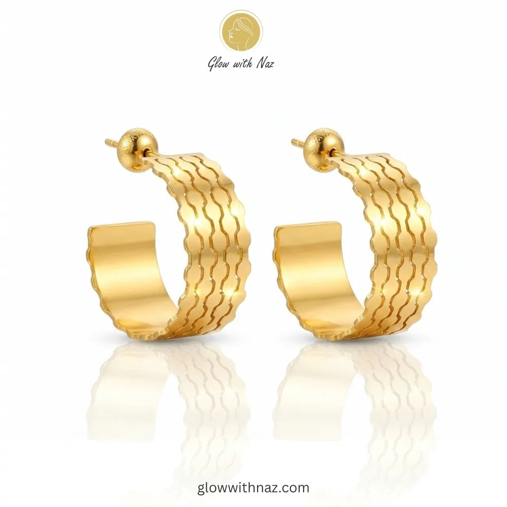 Front view of polished gold wave-textured hoops for casual or formal wear