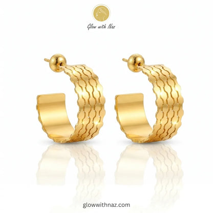 Front view of polished gold wave-textured hoops for casual or formal wear