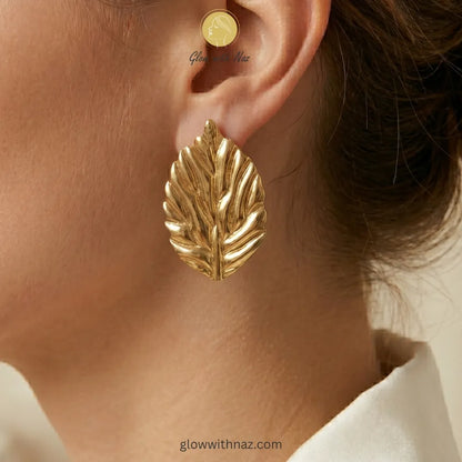 Front view of sculpted gold leaf studs perfect for casual or formal wear
