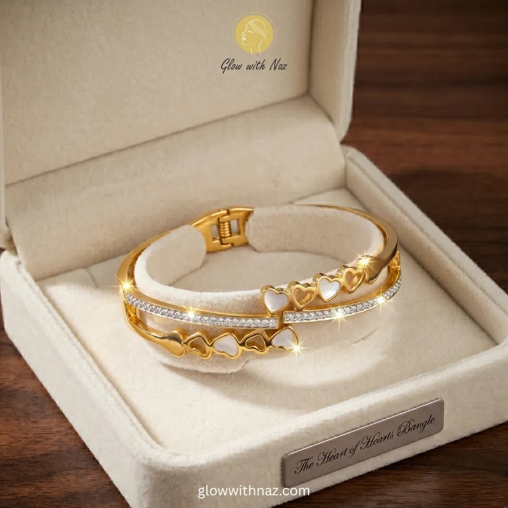 Glow With Naz viral trending gold double-band heart bangle bracelet crafted in stainless steel on a luxury cream jewelry display pad