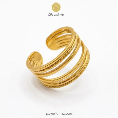 View of an adjustable gold multi-layer band ring, showcasing its modern, stacked silhouette.