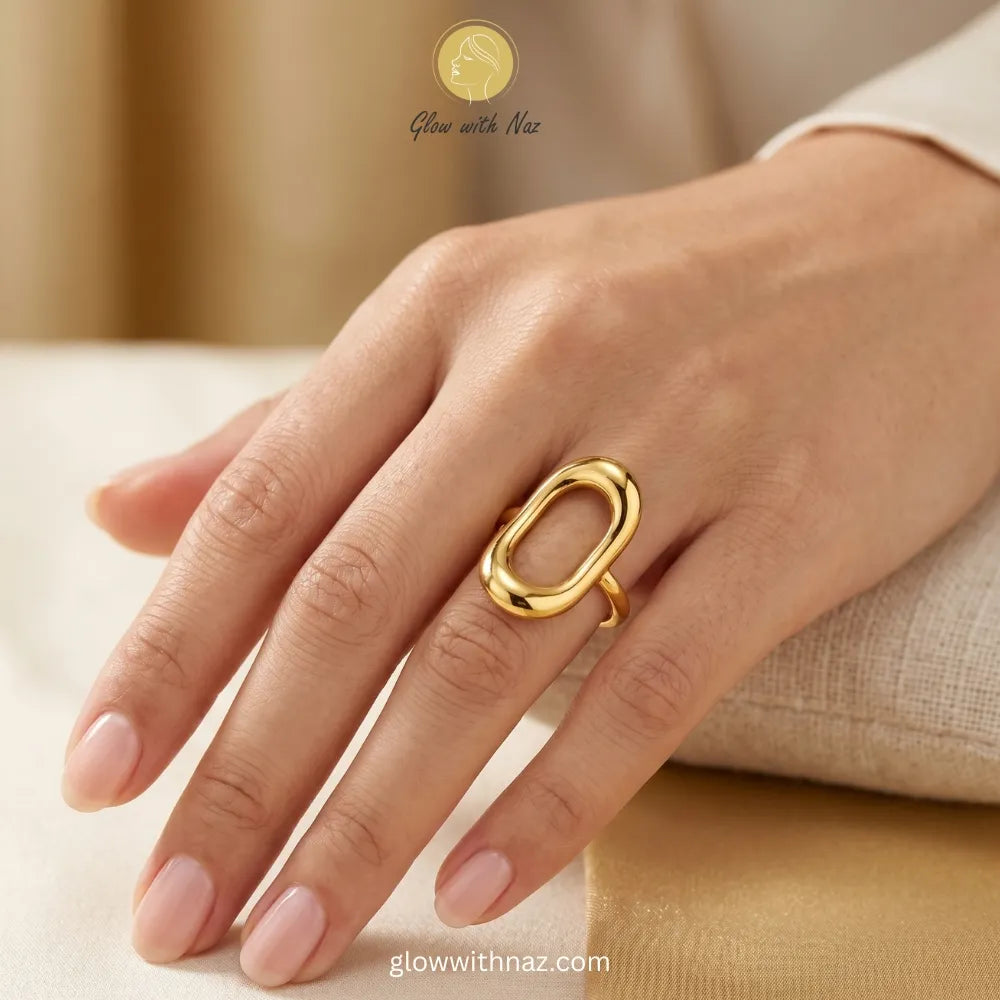 An elegant gold open oval chain link ring with an adjustable band, perfect for a customized fit.
