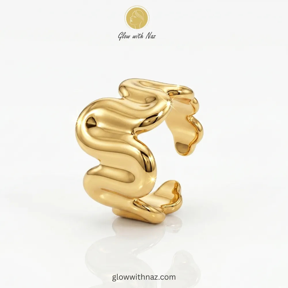 Gold molten wave sculptural adjustable free size ring in 18K gold plated stainless steel, anti-tarnish artistic statement ring available online in Pakistan by Glow with Naz
