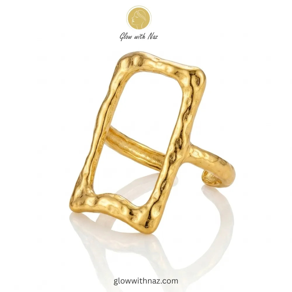 An elegant gold stainless steel ring featuring an open rectangle frame with a unique hammered texture.