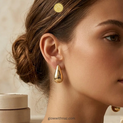 High-quality gold teardrop studs from the Glow with Naz jewelry collection