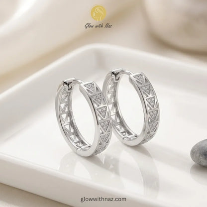 Lifestyle shot of modern geometric silver hoop earrings for everyday style