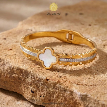Minimalist clover motif gold bangle styled for everyday luxury