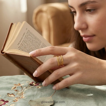 Contemporary gold multi-layer ring with a sleek stacked aesthetic, by Glow with Naz.