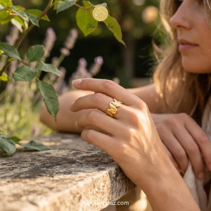 A modern, sculptural molten gold wave ring, perfect for everyday statement styling.