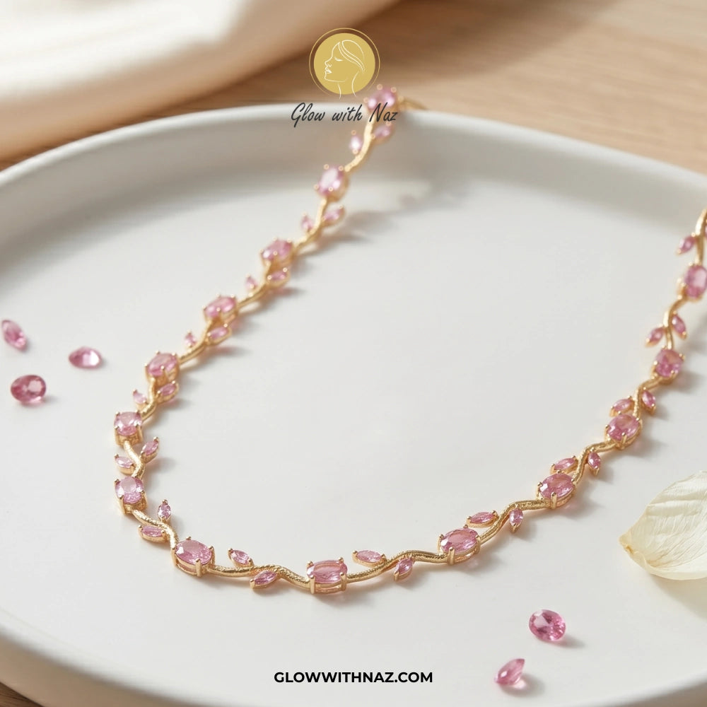 Pink tulip Necklace with pink stones on a white plate, brand 'Glow with Naz' visible