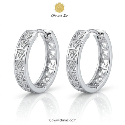 Pair of elegant silver-tone hoop earrings with intricate geometric triangular cut-out patterns