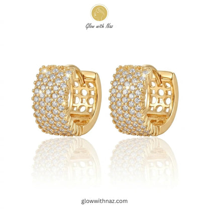 Pair of radiant gold-tone crystal pave hoop earrings featuring intricate side openwork