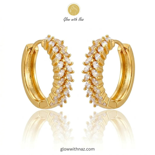 Pair of radiant gold-tone marquise crystal hoop earrings featuring intricate stone settings
