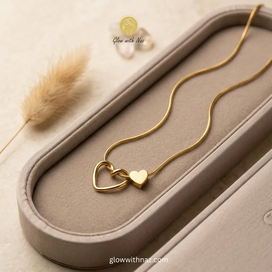 Premium quality double heart interlocking gold pendant on snake chain necklace in velvet-lined display tray — anti-tarnish stainless steel by Glow with Naz