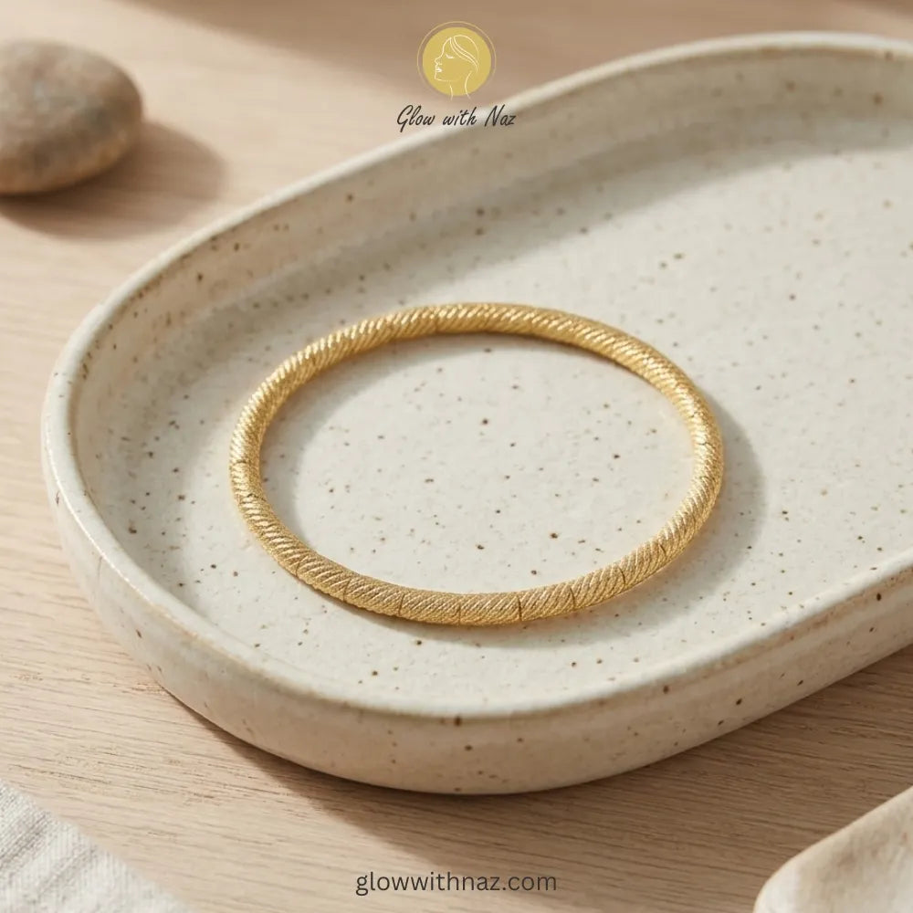 Premium twisted gold bangle packaged as a gift
