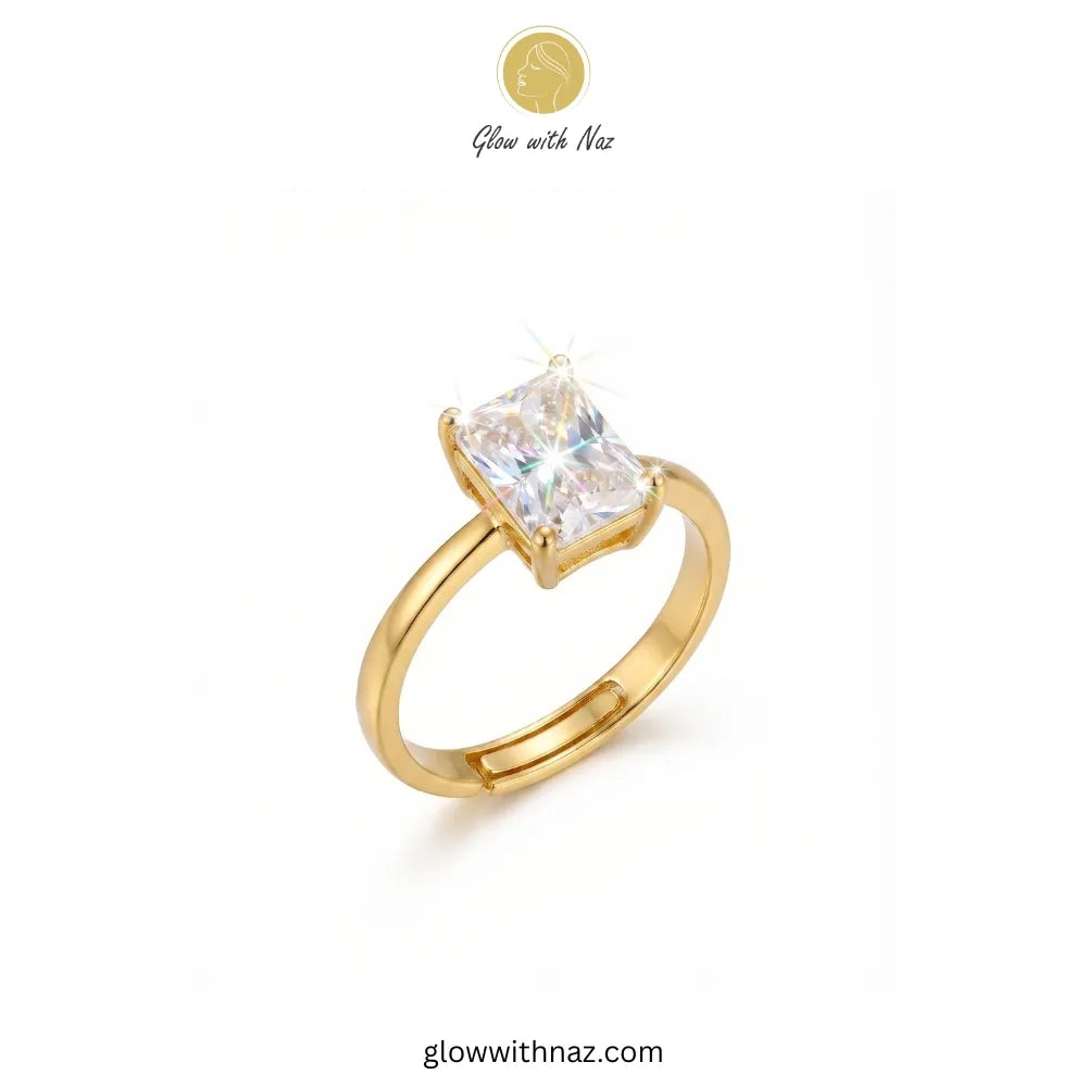 Golden radiant rectangle diamond ring sparkling on a white background