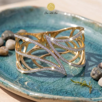 Statement gold cuff styled with elegant evening accessories