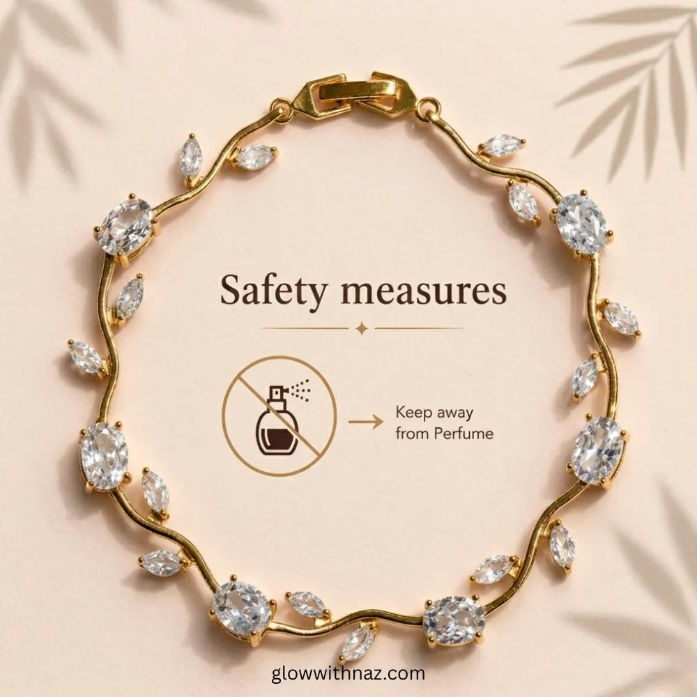 Gold wavy bracelet with marquise and oval clear crystals, displayed on a beige background with text reading 'Safety measures' and a perfume prohibition icon. Tulip Rapunzel bracelet, floral tulip bracelet, Rapunzel inspired jewelry, aesthetic tulip bracelet, trendy charm bracelet, stainless steel tulip bracelet, gold plated flower bracelet, delicate floral wrist accessory, cute aesthetic jewelry, viral tulip bracelet, Rapunzel theme accessories, dainty floral bracelet, crystal tulip charm, stacking bracelet