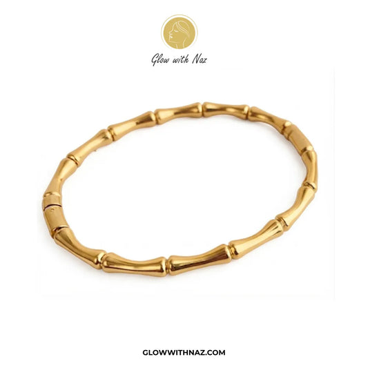 Gold bamboo joint link cuff bangle flat lay view on white background by Glow With Naz