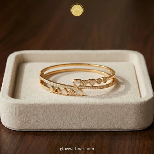 Bundle Offer: Anti-Tarnish Heart Bangle Bracelet & Stainless Steel White Ring - Bundle Offer: Anti-Tarnish Heart Bangle Bracelet & Stainless Steel White RingJewelryGlow With NazGlow With Naz6Elegant minimalist jewelry showcasing a stunning gold-plated stainless steel bracelet featuring mother-of-pearl and crystal hearts.