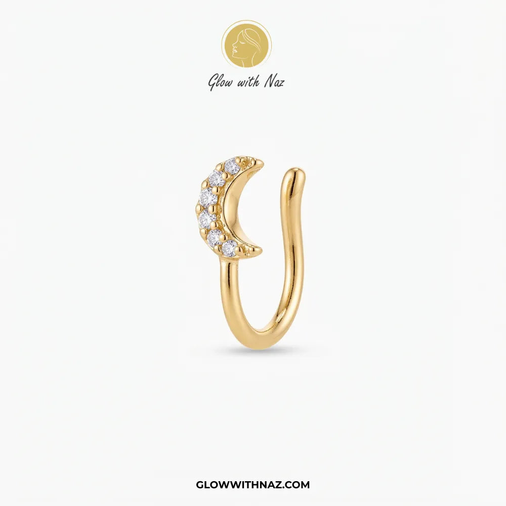 Gold non-pierced chutki crescent moon nose pin with clear zircon crystals on white background by Glow With Naz