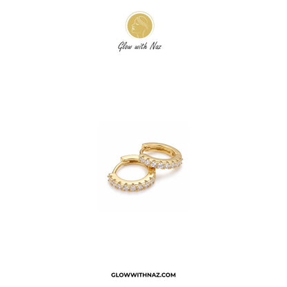 Cute Mini Zircon Crystal Hoop for Girls - Cute Mini Zircon Crystal Hoop for GirlsJewelryGlow With NazGlow With NazE039A pair of gold huggie hoop earrings adorned with small clear pavé stones, displayed on a clean white background with the brand logo 'Glow with Naz' at the top and 'GLOWWITHNAZ.COM' at the bottom.studs earrings, small earrings, girls earrings, simple earrings, earrings for girls, black earrings, earrings, ear rings, earrings tops, stud earrings, tops earrings, aesthetic earrings, 