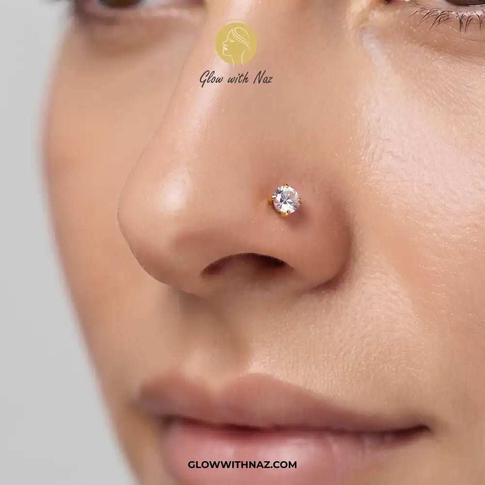 Diamond Zircon Nose Pin & Helix Piercing Jewelry - Diamond Zircon Nose Pin & Helix Piercing JewelryJewelryGlow With NazGlow With NazNR007Close-up of a person's nose wearing a small round clear stud earring, with visible Glow with Naz branding and watermark text on a light gray background. diamond nose pin, helix piercing jewelry, stainless steel nose stud, zircon nose ring, Glow With Naz jewelry, viral trending piercing, cartilage piercing, body jewelry, nose piercing, tragus piercing, daith pie