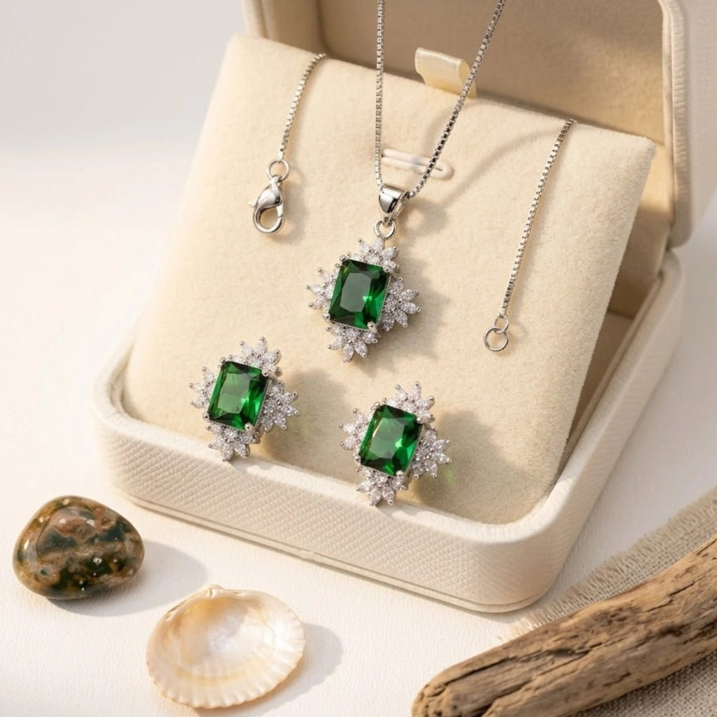 Elegant Sun Flower Style Necklace & Earrings Set - Elegant Sun Flower Style Necklace & Earrings SetJewelryGlow With NazGlow With NazN-N012N-N012silver jewelry set featuring an emerald - cut green crystal pendant necklace and matching stud earrings, both surrounded by a sparkling cubic zirconia floral halo